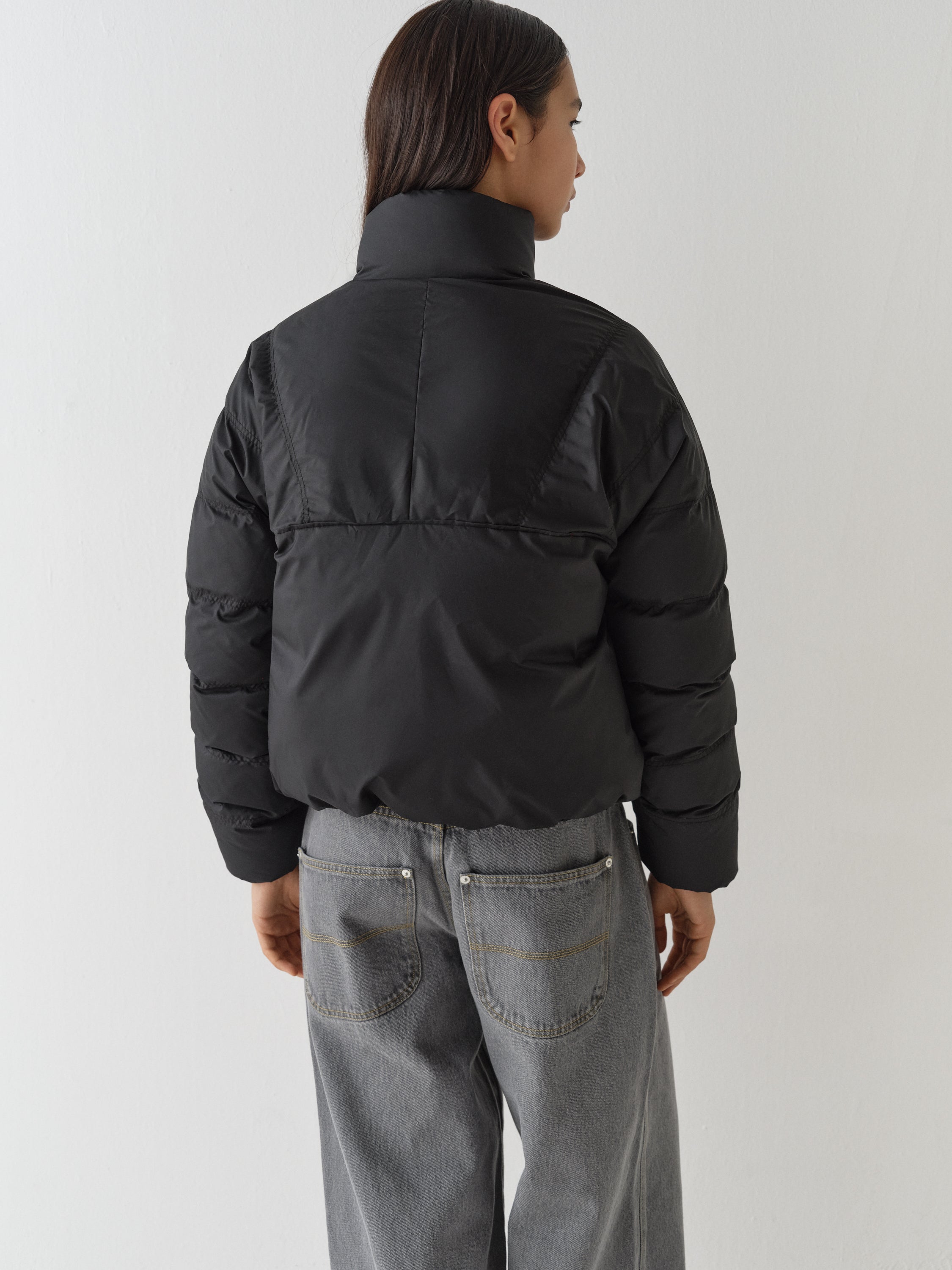 Unisex black puffer jacket with asymmetric flap – Gimaguas