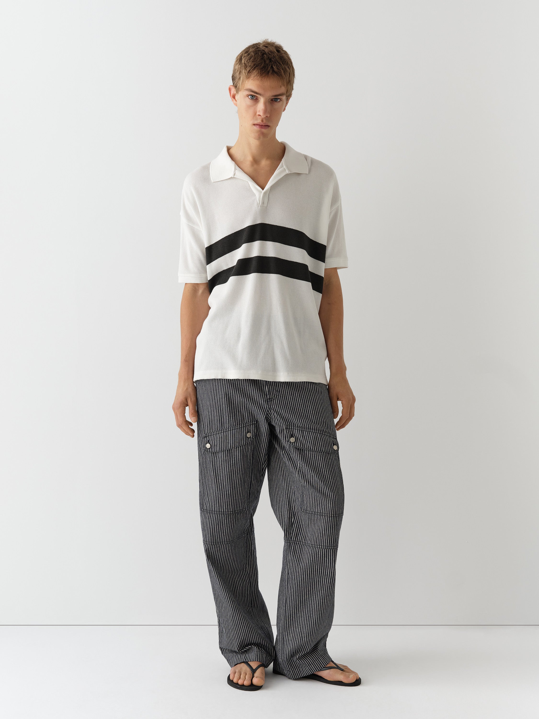 Unisex blue striped trousers with flap pockets and straight fit