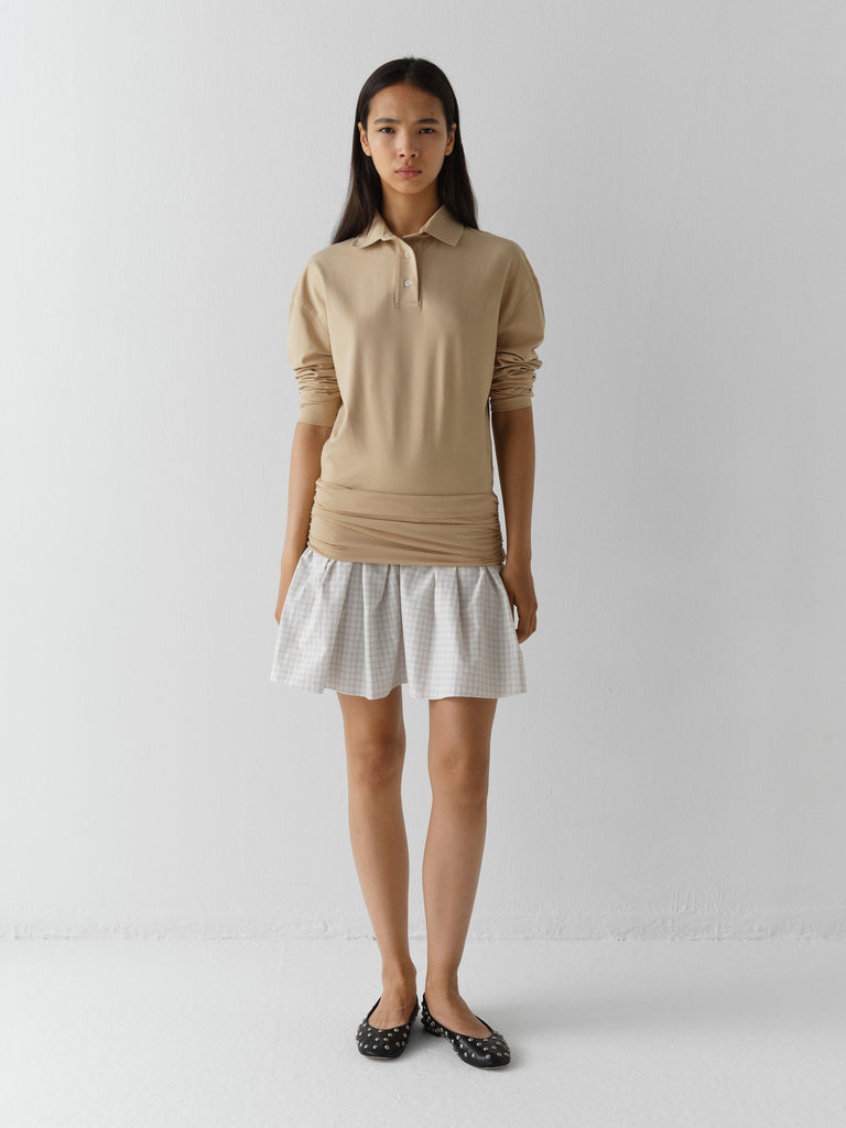 Beige long-sleeve polo dress for women with checkered skirt – Gimaguas Beige long-sleeve polo dress for women with checkered skirt – Gimaguas