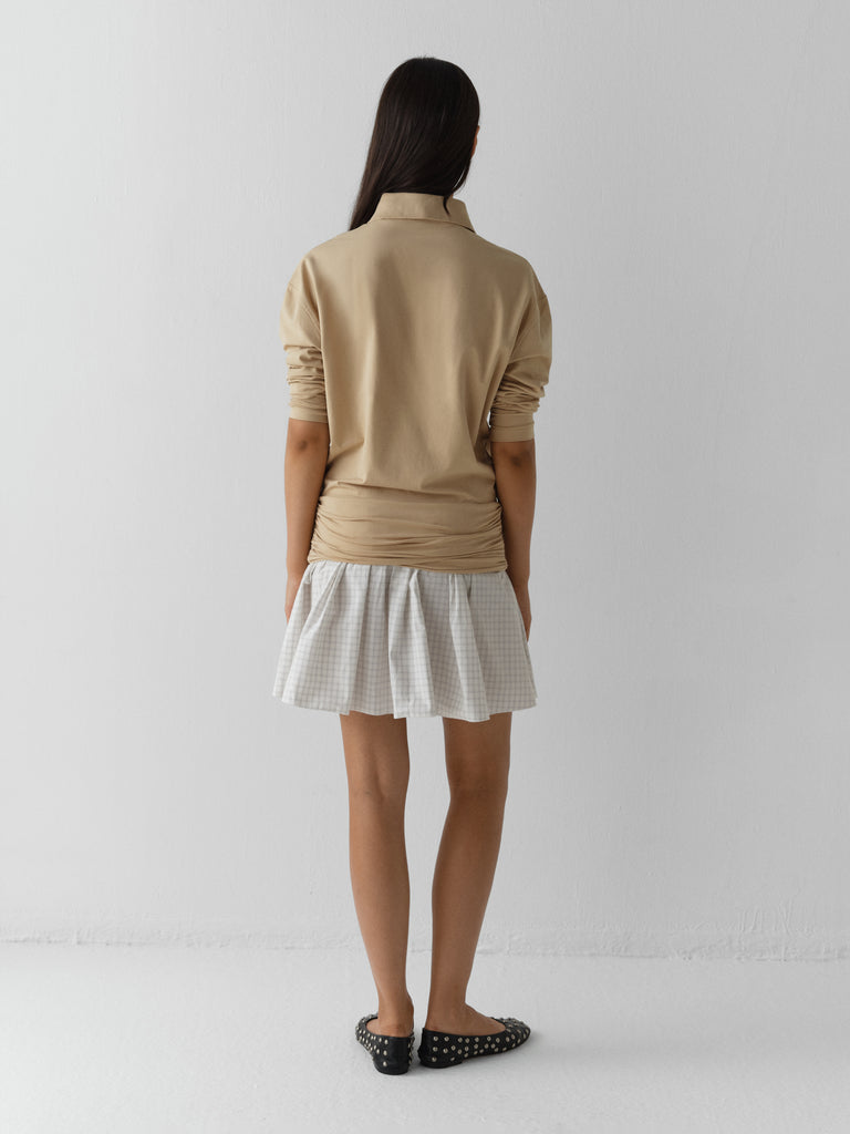 Beige long-sleeve polo dress for women with checkered skirt – Gimaguas Beige long-sleeve polo dress for women with checkered skirt – Gimaguas