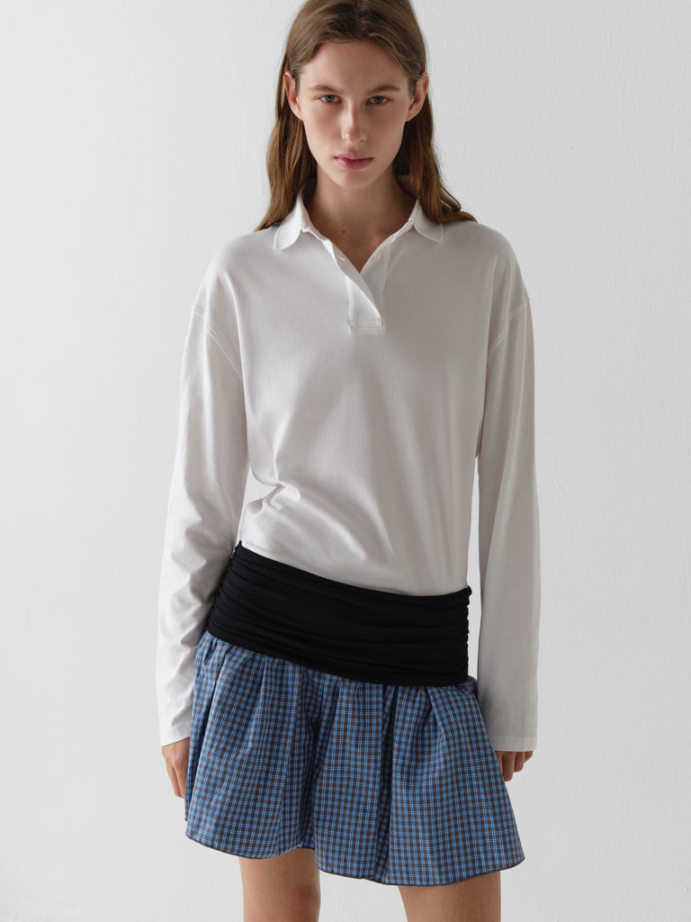 White long-sleeve polo dress for women with checkered skirt Gimaguas White long-sleeve polo dress for women with checkered skirt Gimaguas