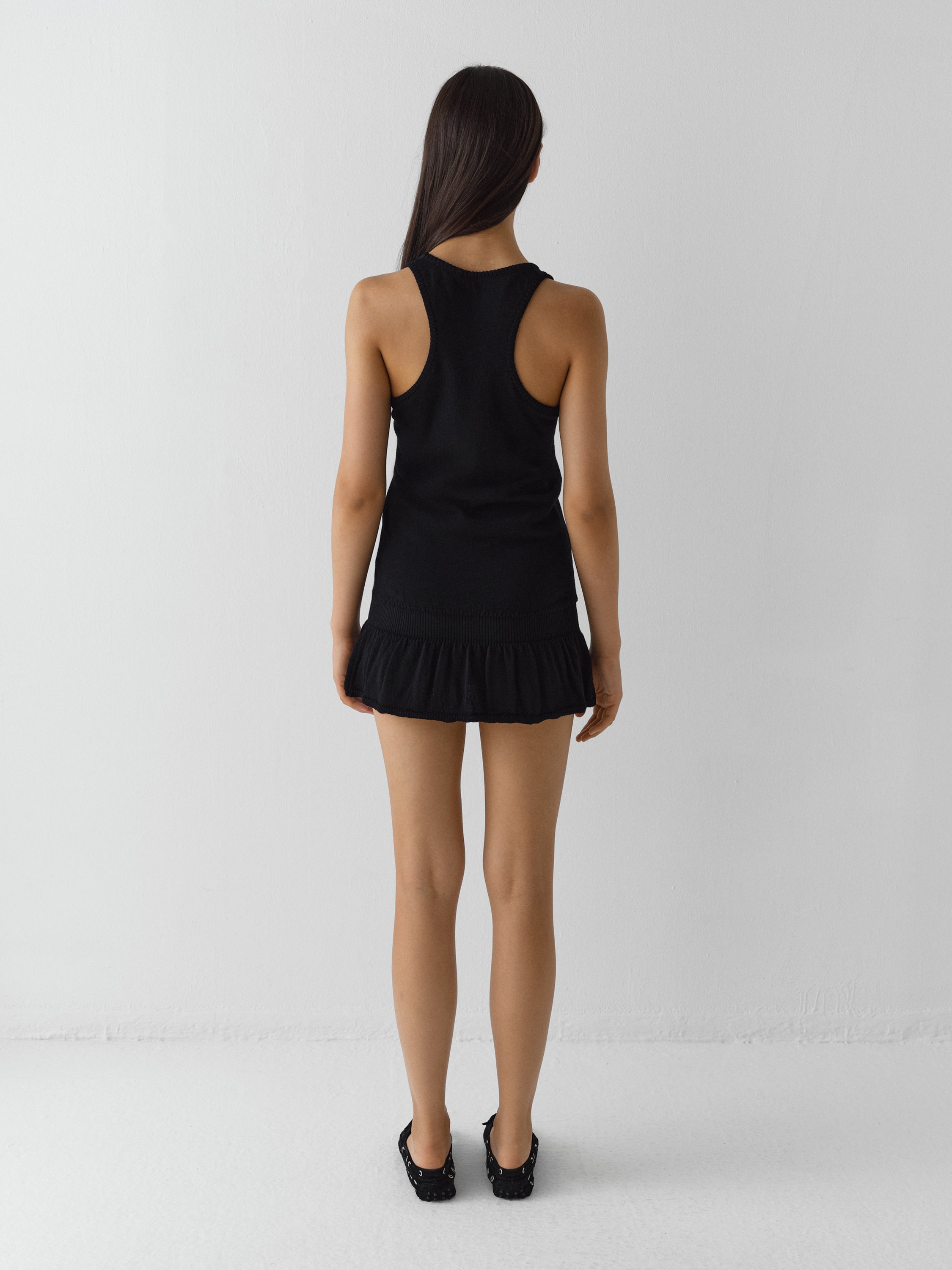 Black sleeveless mini dress with ruffled hem - Gimaguas
