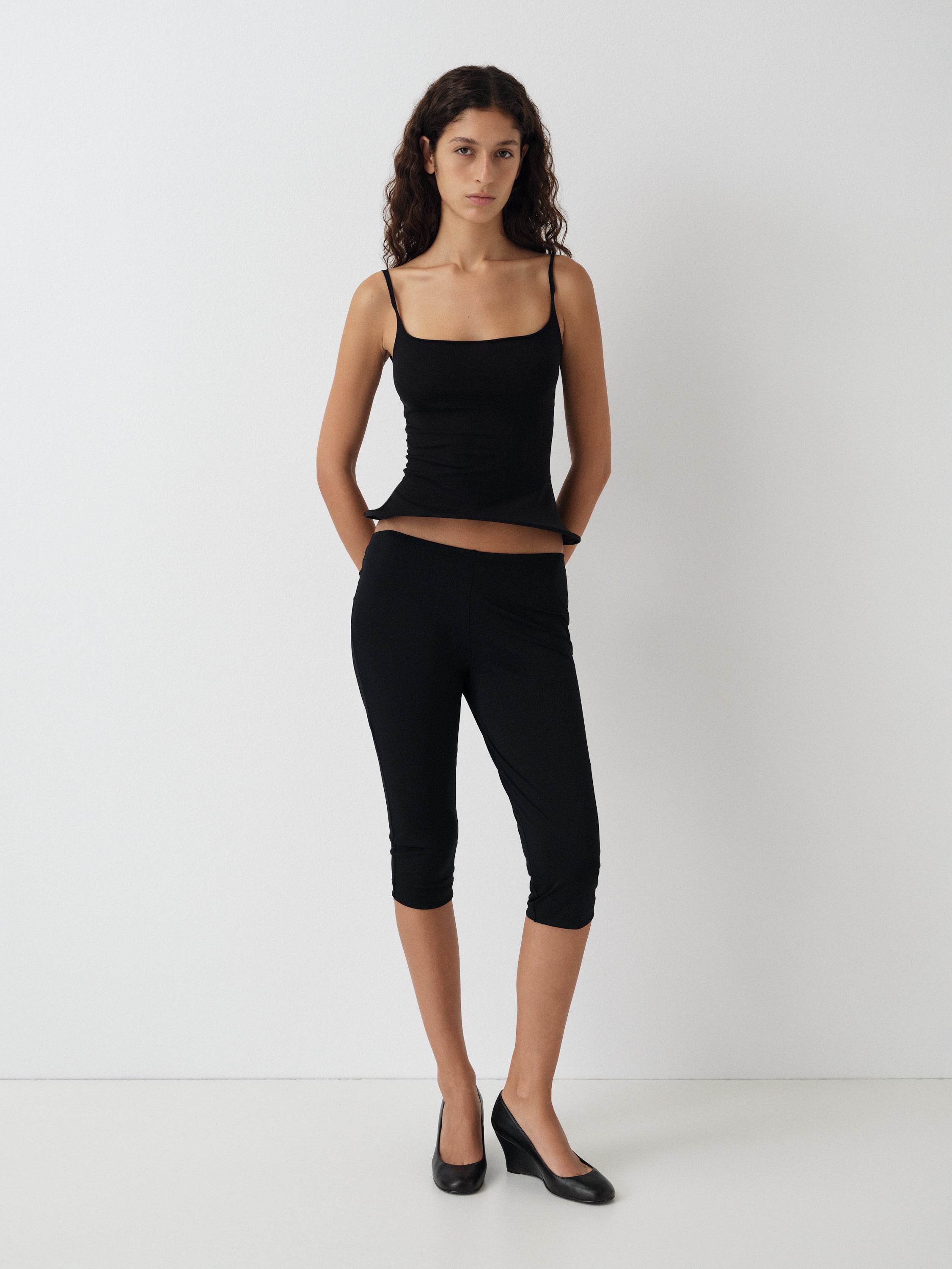 Women's Black Fitted Top Flared Hem. Gimaguas