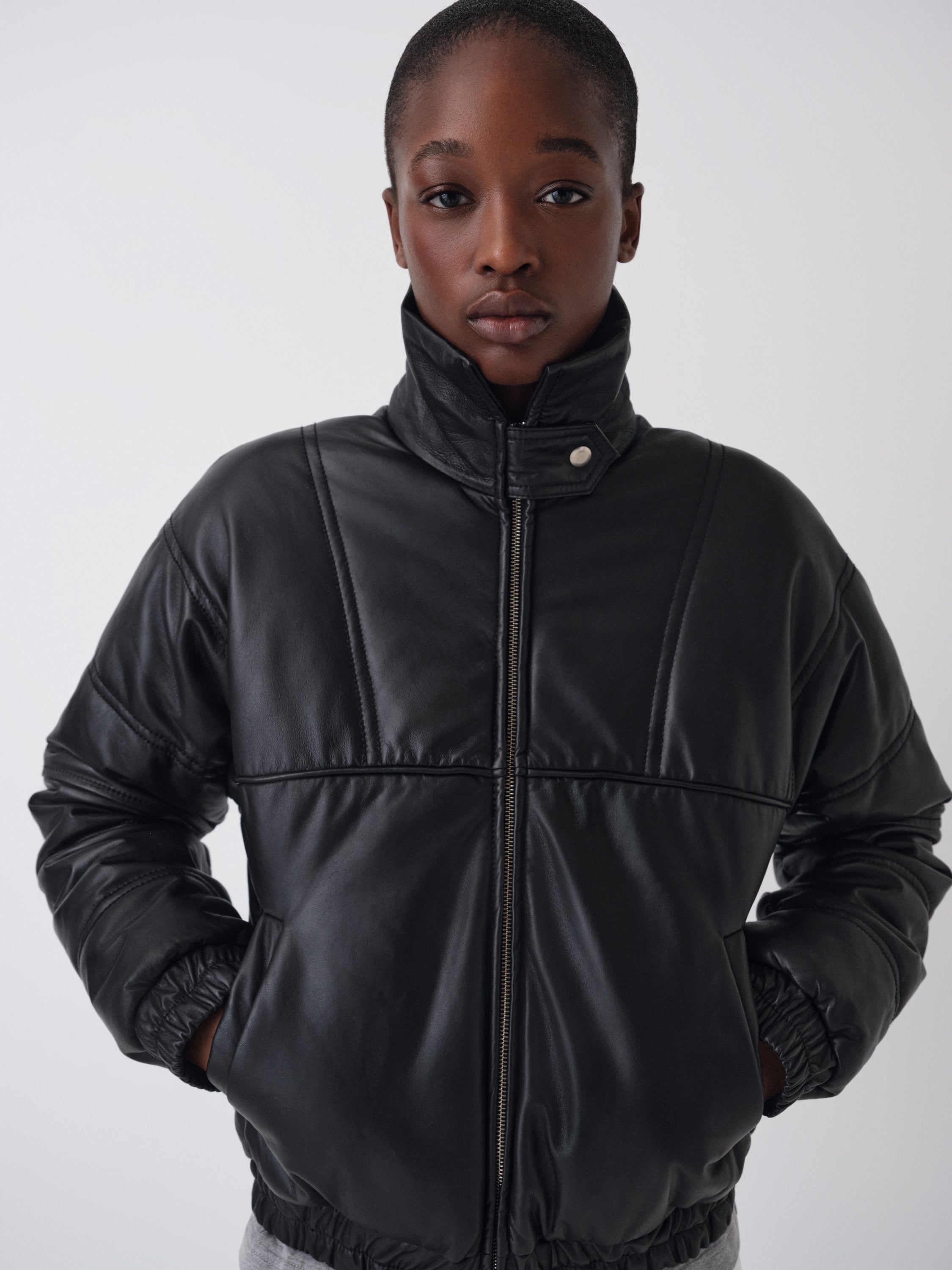 Women's black leather puffer jacket with asymmetric flap – Gimaguas