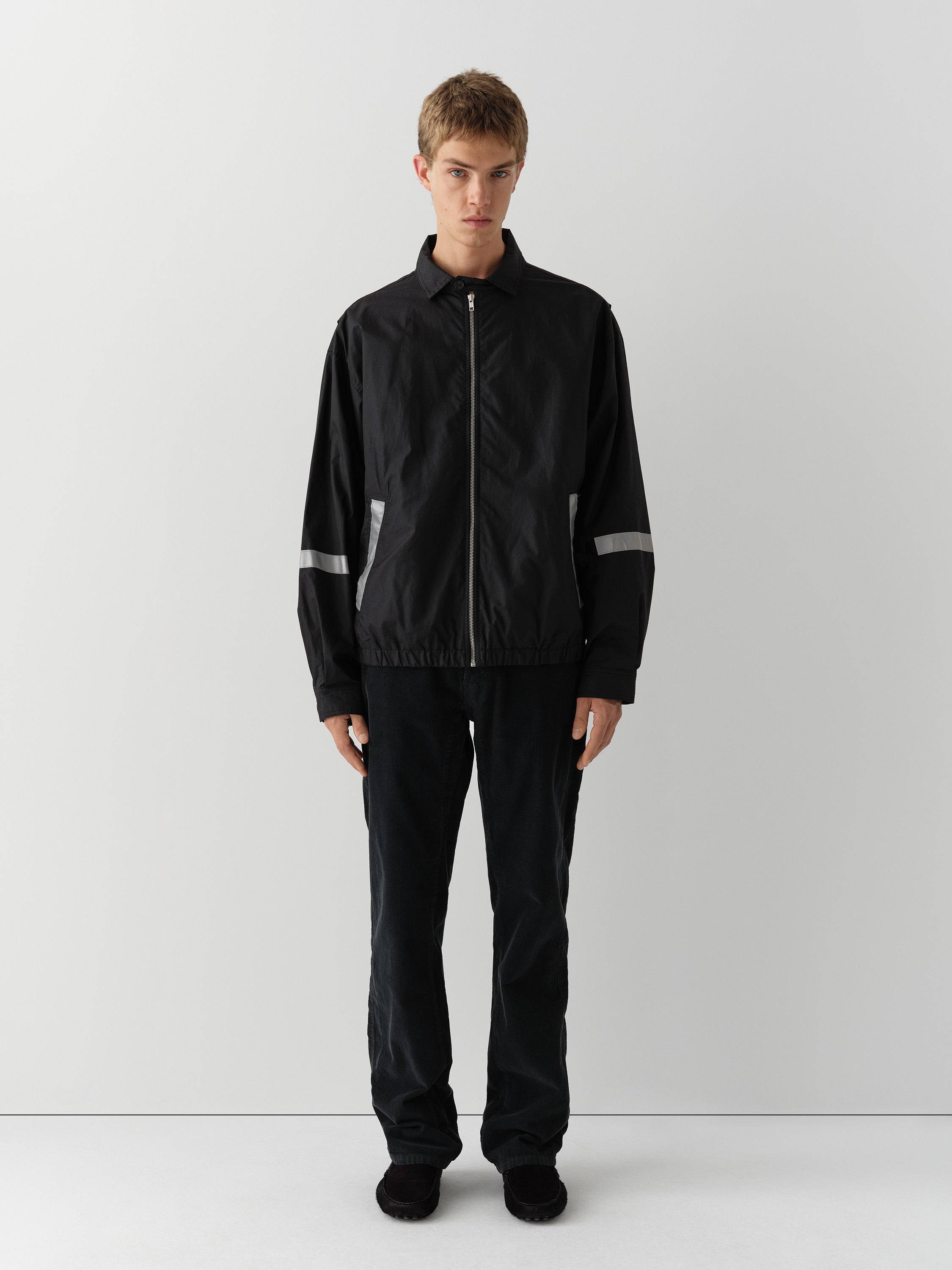 Black unisex waxed-effect jacket with reflective details – Gimaguas