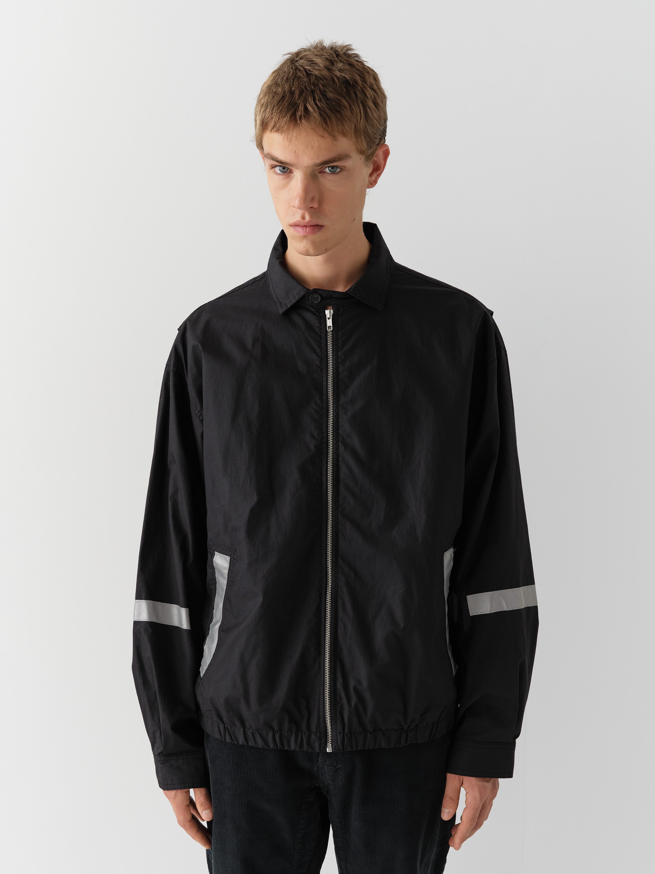 Black unisex waxed-effect jacket with reflective details – Gimaguas
