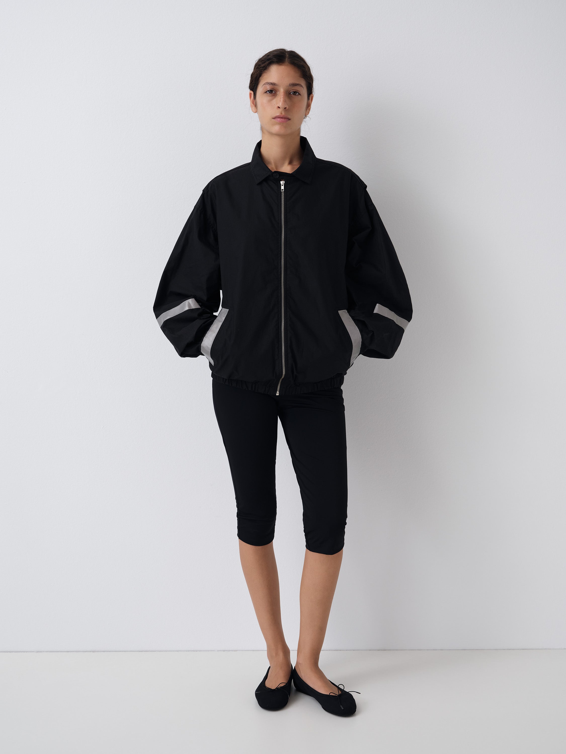 Black unisex waxed-effect jacket with reflective details – Gimaguas
